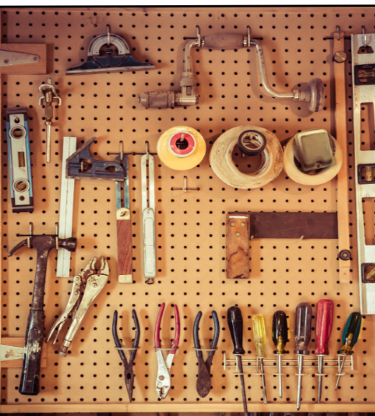 Peg board holding a collection of woodworking tools