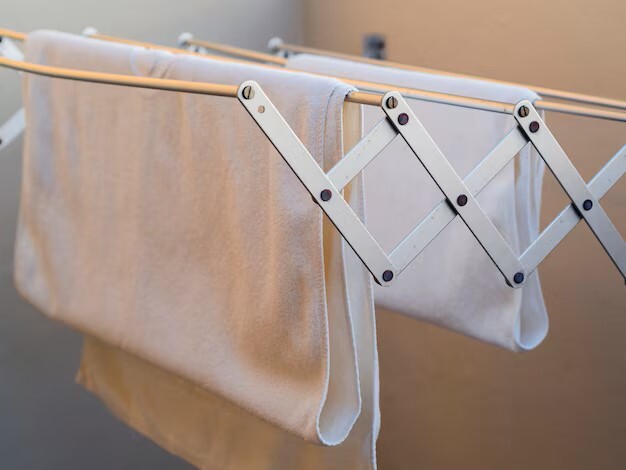 Linens draped over a drying rack